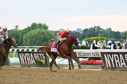Picture of Justify winning the Belmont Stakes.