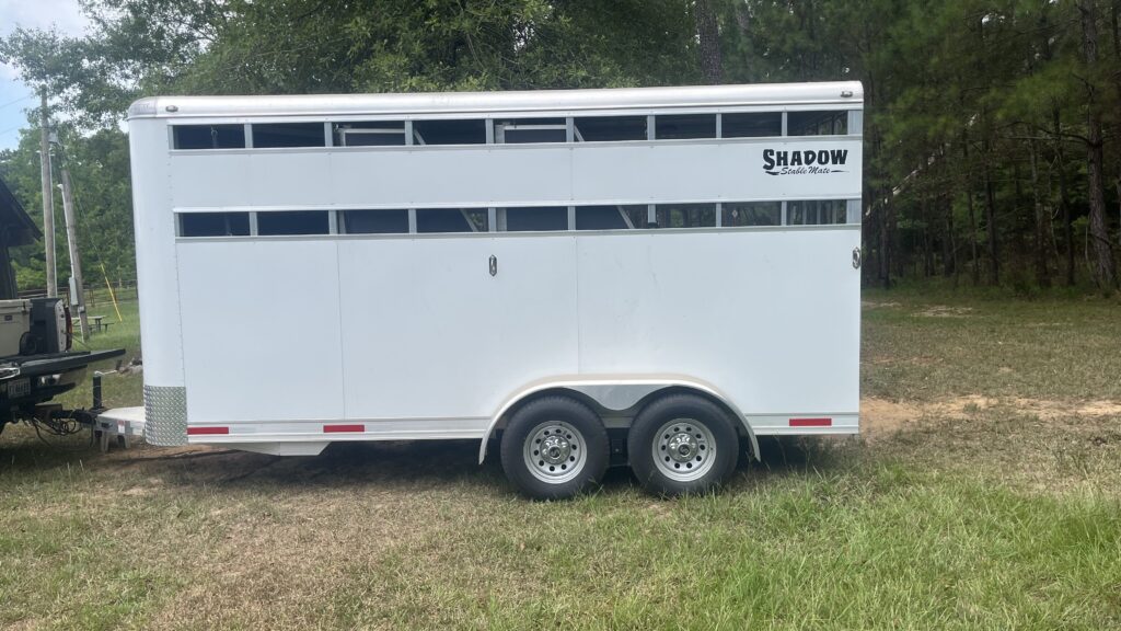 Picture of a lightweight aluminum bumper pull horse trailer. 