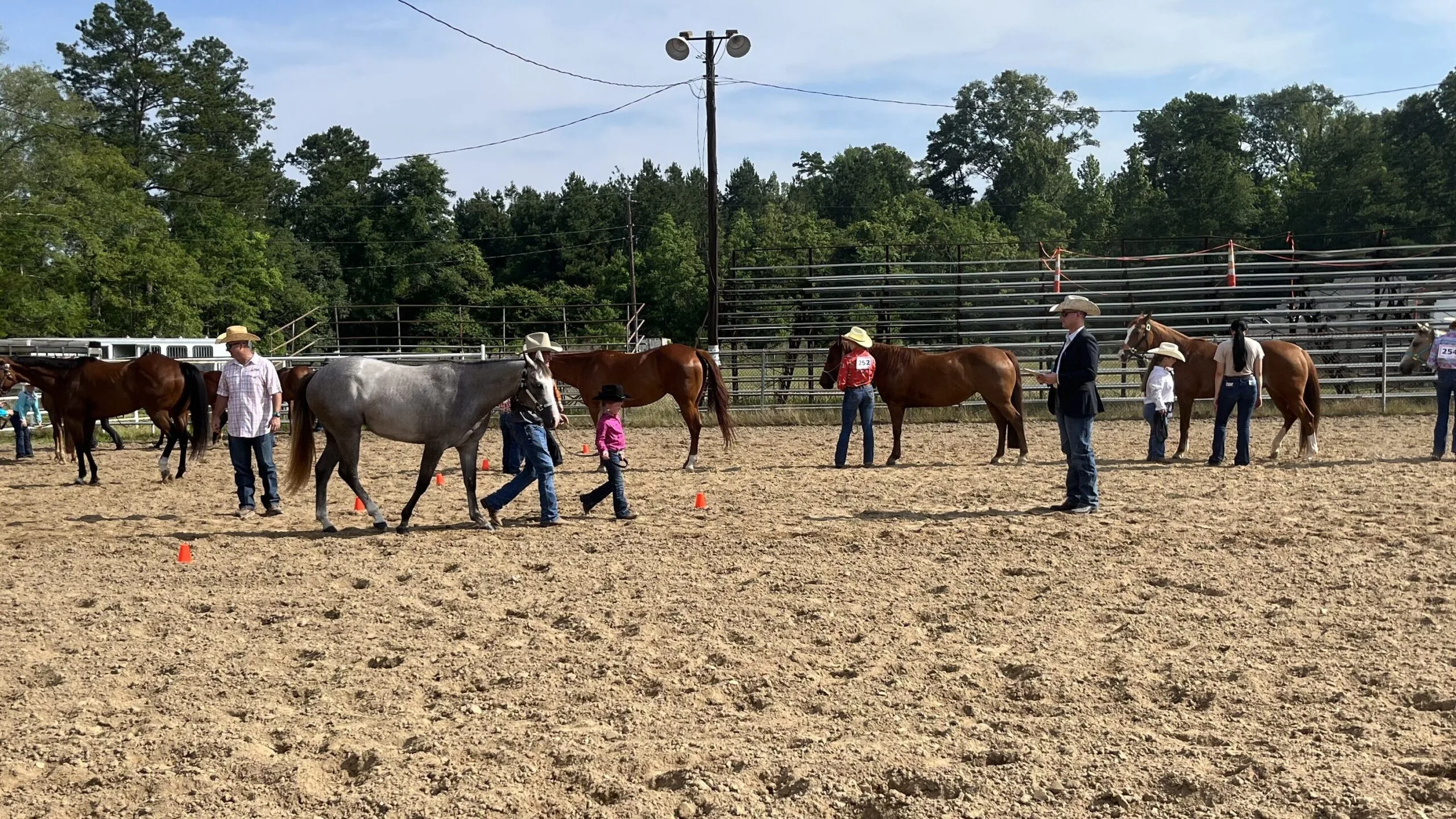 Picture of young children showing their quarter horses.