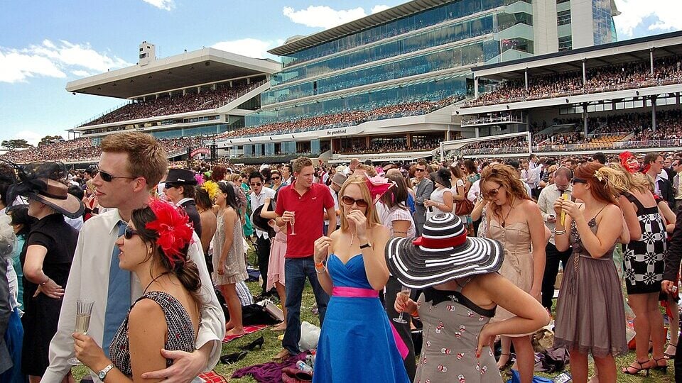 Crowd of fans watching the Melbourne Cup at Flemington Racecourse