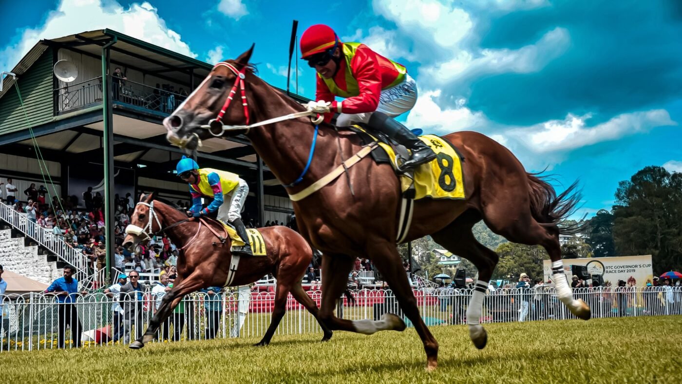 Horse Racing Handicapping: Smart Betting Tips for Beginners Thoroughbred racehorses and jockeys competing fiercely on a sunny racetrack, capturing the thrill of horse racing.
