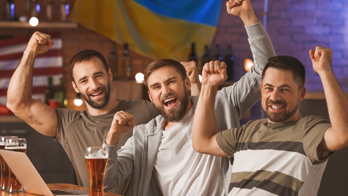 Group of bettors celebrating a winning exotic bet at the racetrack