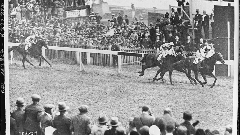 Black-and-white photograph of the 1932 Epsom Derby field rounding Tattenham Corner &mdash; one of the biggest horse races in the world since 1780
