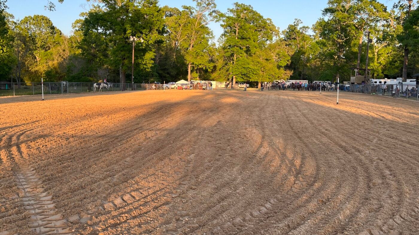 Arena at a Western horse show set up for poles event. 